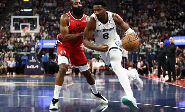 Memphis Grizzlies forward Jaren Jackson Jr. (8) drives against Los Angeles Clippers guard James Harden, left, during the first half of an NBA Cup basketball game Friday, Nov. 28, 2025, in Inglewood, Calif. (AP Photo/Jessie Alcheh)