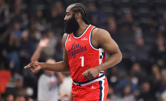 Los Angeles Clippers guard James Harden gestures after making a 3-point basket against the Memphis Grizzlies during the first half of an NBA Cup basketball game Friday, Nov. 28, 2025, in Inglewood, Calif. (AP Photo/Jessie Alcheh)