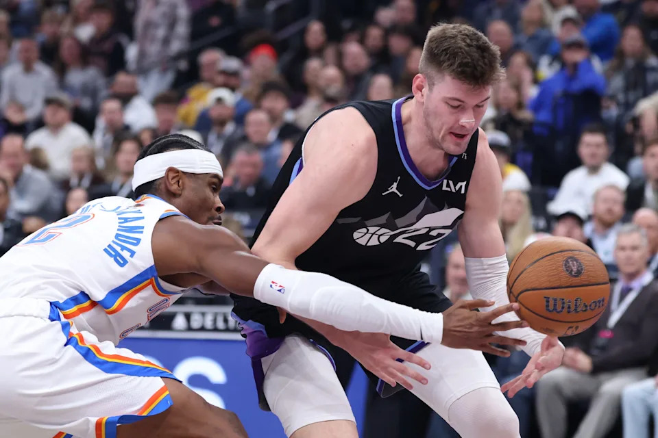 Nov 21, 2025; Salt Lake City, Utah, USA; Oklahoma City Thunder guard Shai Gilgeous-Alexander (2) tips the ball away from Utah Jazz forward Kyle Filipowski (22) during the first half at Delta Center. Mandatory Credit: Rob Gray-Imagn Images