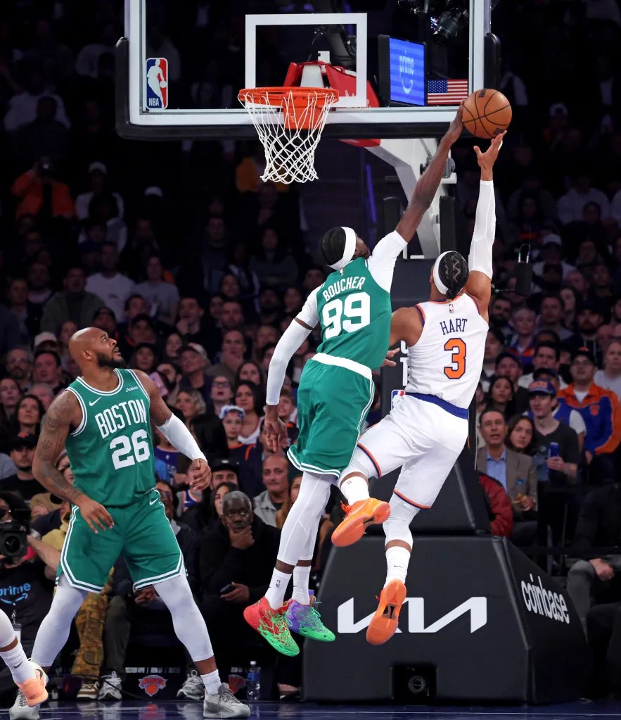 New York Knicks guard Josh Hart goes up for a shot as Boston Celtics forward Chris Boucher defends during the first quarter. Charles Wenzelberg / New York Post