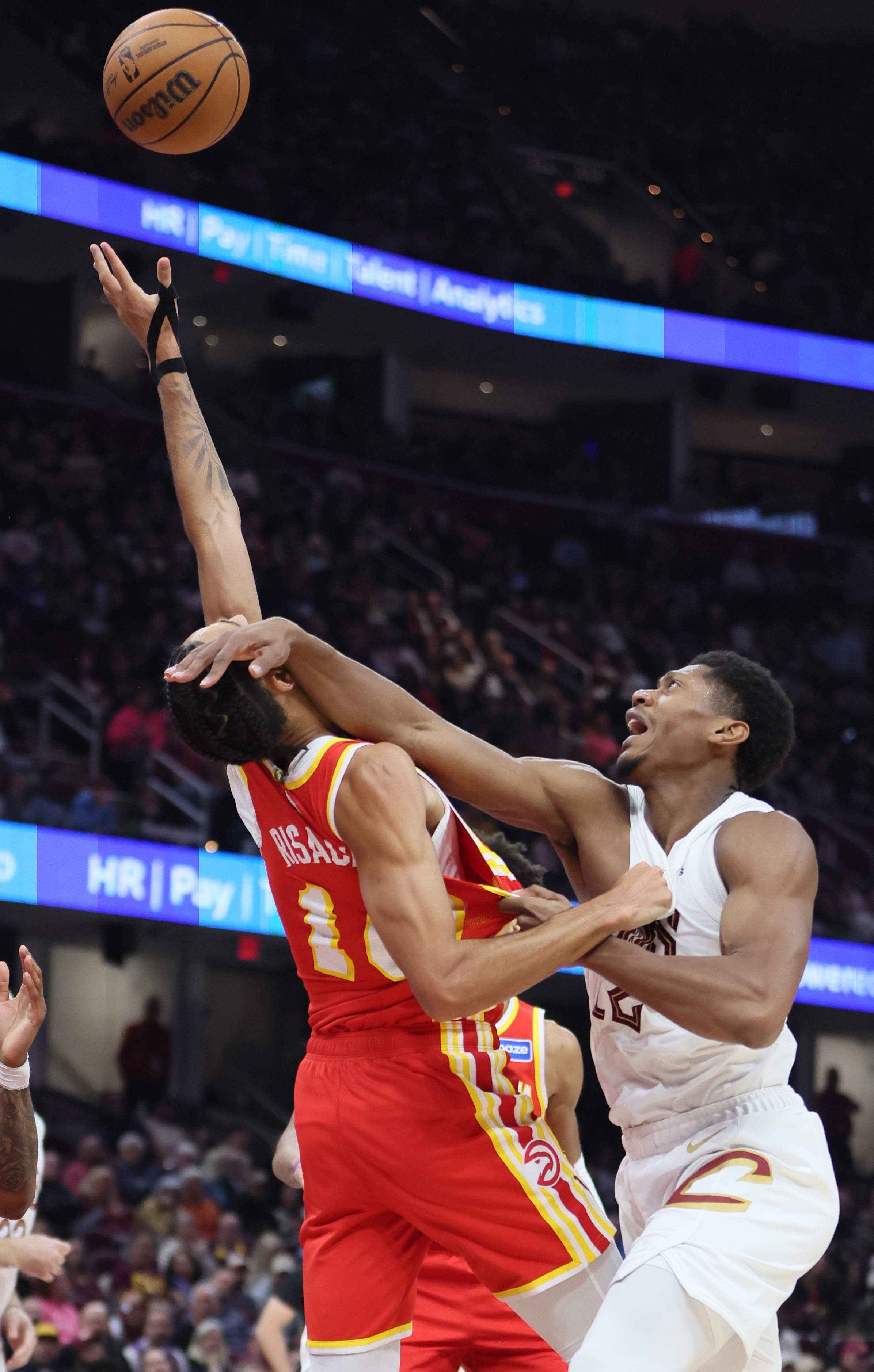 Cleveland Cavaliers forward De'Andre Hunter hits the face of Atlanta Hawks forward Zaccharie Risacher on a rebound in the first half at Rocket Arena. 