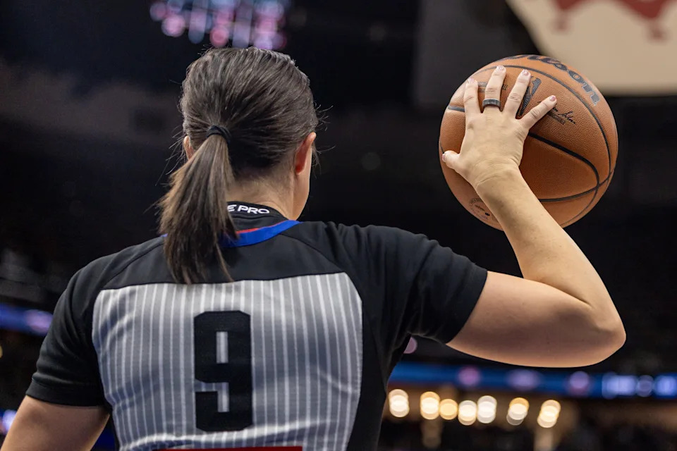 Nov 17, 2025; New Orleans, Louisiana, USA; Referee Natalie Sago (9) holds the ball during a time out during the game between the New Orleans Pelicans and the Oklahoma City Thunder the second half at Smoothie King Center. Mandatory Credit: Stephen Lew-Imagn Images