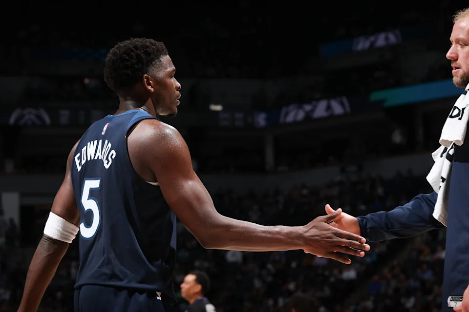 MINNEAPOLIS, MN – NOVEMBER 19: Anthony Edwards #5 of the Minnesota Timberwolves high fives a staff member during the game against the Washington Wizards on November 19, 2025 at Target Center in Minneapolis, Minnesota. NOTE TO USER: User expressly acknowledges and agrees that, by downloading and or using this Photograph, user is consenting to the terms and conditions of the Getty Images License Agreement. Mandatory Copyright Notice: Copyright 2025 NBAE (Photo by David Sherman/NBAE via Getty Images)