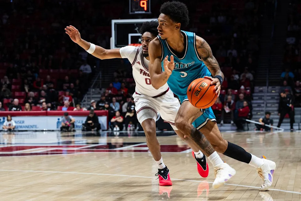 San Diego State guard Elzie Harrington (3) drives during an NCAA Basketball game against Troy, Tuesday November 18, 2025 at Viejas Arena in San Diego, Calif.