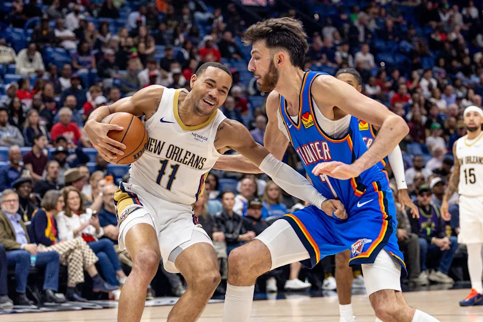 Nov 17, 2025; New Orleans, Louisiana, USA; New Orleans Pelicans guard Bryce McGowens (11) fights for position against Oklahoma City Thunder center/forward Chet Holmgren (7) during the second half at Smoothie King Center. Mandatory Credit: Stephen Lew-Imagn Images