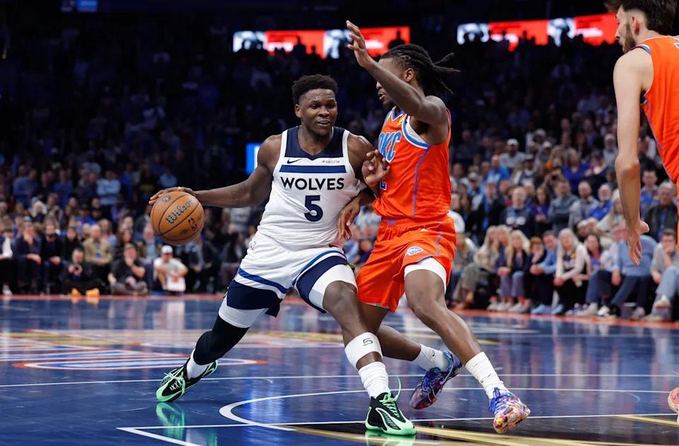 Nov 26, 2025; Oklahoma City, Oklahoma, USA; Minnesota Timberwolves guard Anthony Edwards (5) moves to the basket beside Oklahoma City Thunder guard Cason Wallace (22) during the second half at Paycom Center. Mandatory Credit: Alonzo Adams-Imagn Images