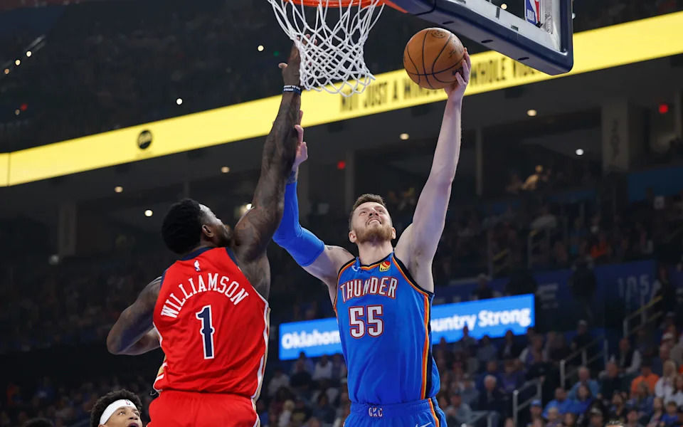 Nov 2, 2025; Oklahoma City, Oklahoma, USA; Oklahoma City Thunder center Isaiah Hartenstein (55) shoots as New Orleans Pelicans forward Zion Williamson (1) defends during the first quarter at Paycom Center. Mandatory Credit: Alonzo Adams-Imagn Images