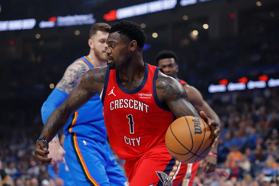 Nov 2, 2025; Oklahoma City, Oklahoma, USA;New Orleans Pelicans forward Zion Williamson (1) moves the ball around Oklahoma City Thunder center Isaiah Hartenstein (55) after a rebound during the first quarter at Paycom Center. Mandatory Credit: Alonzo Adams-Imagn Images