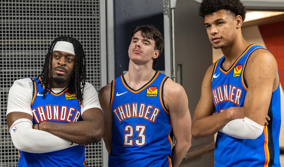 Nov 17, 2025; New Orleans, Louisiana, USA; Oklahoma City Thunder guard Luguentz Dort (5) and guard Brooks Barnhizer (23) and forward Ousmane Dieng (13) pose for a picture after the game against the New Orleans Pelicans at Smoothie King Center. Mandatory Credit: Stephen Lew-Imagn Images