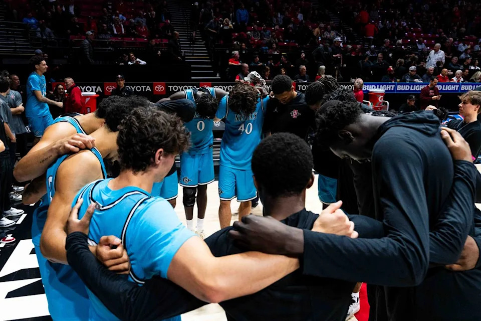 San Diego State players huddle before an NCAA Basketball game against Troy, Tuesday November 18, 2025 at Viejas Arena in San Diego, Calif.