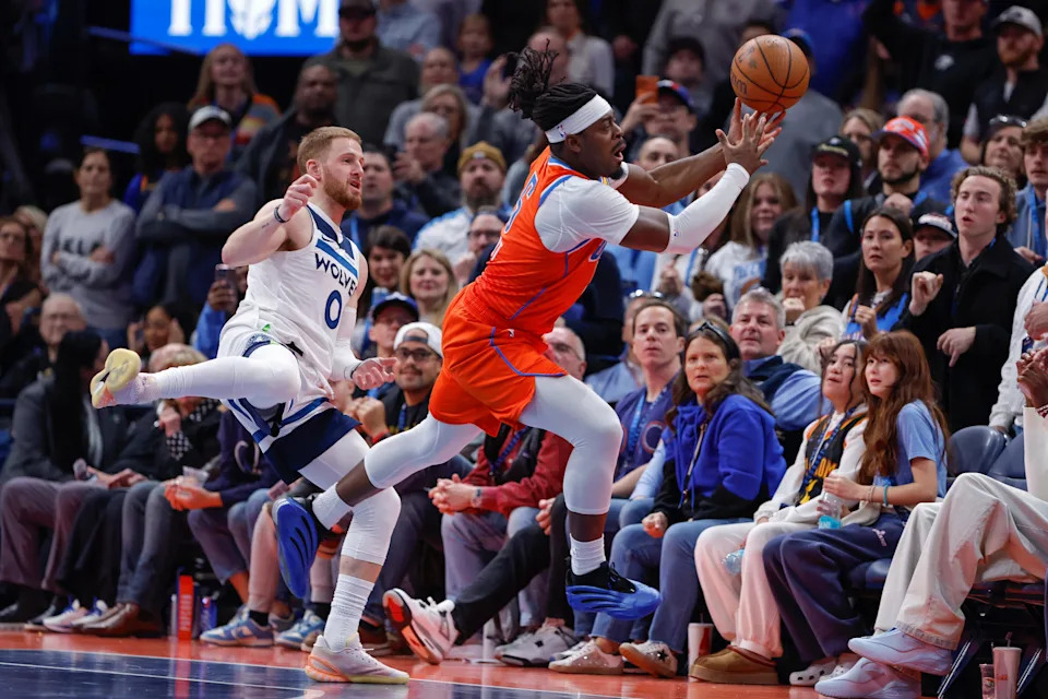 Nov 26, 2025; Oklahoma City, Oklahoma, USA; Oklahoma City Thunder guard Luguentz Dort (5) and Minnesota Timberwolves guard Donte DiVincenzo (0) jump for a loose ball during the second half at Paycom Center. Mandatory Credit: Alonzo Adams-Imagn Images