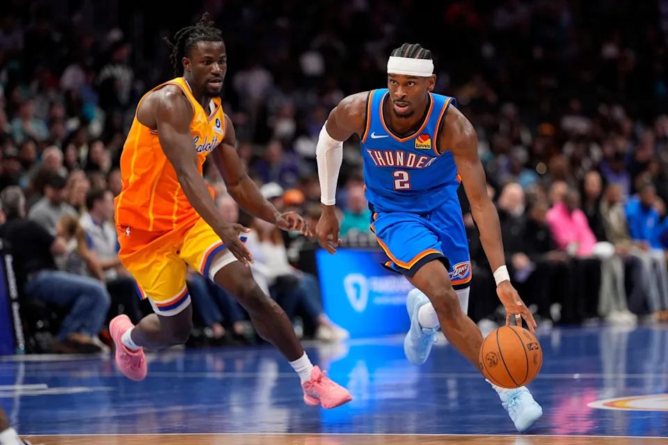 Nov 15, 2025; Charlotte, North Carolina, USA; Oklahoma City Thunder guard Shai Gilgeous-Alexander (2) drives to the basket against Charlotte Hornets guard Sion James (4)during the second half at Spectrum Center. Mandatory Credit: Jim Dedmon-Imagn Images