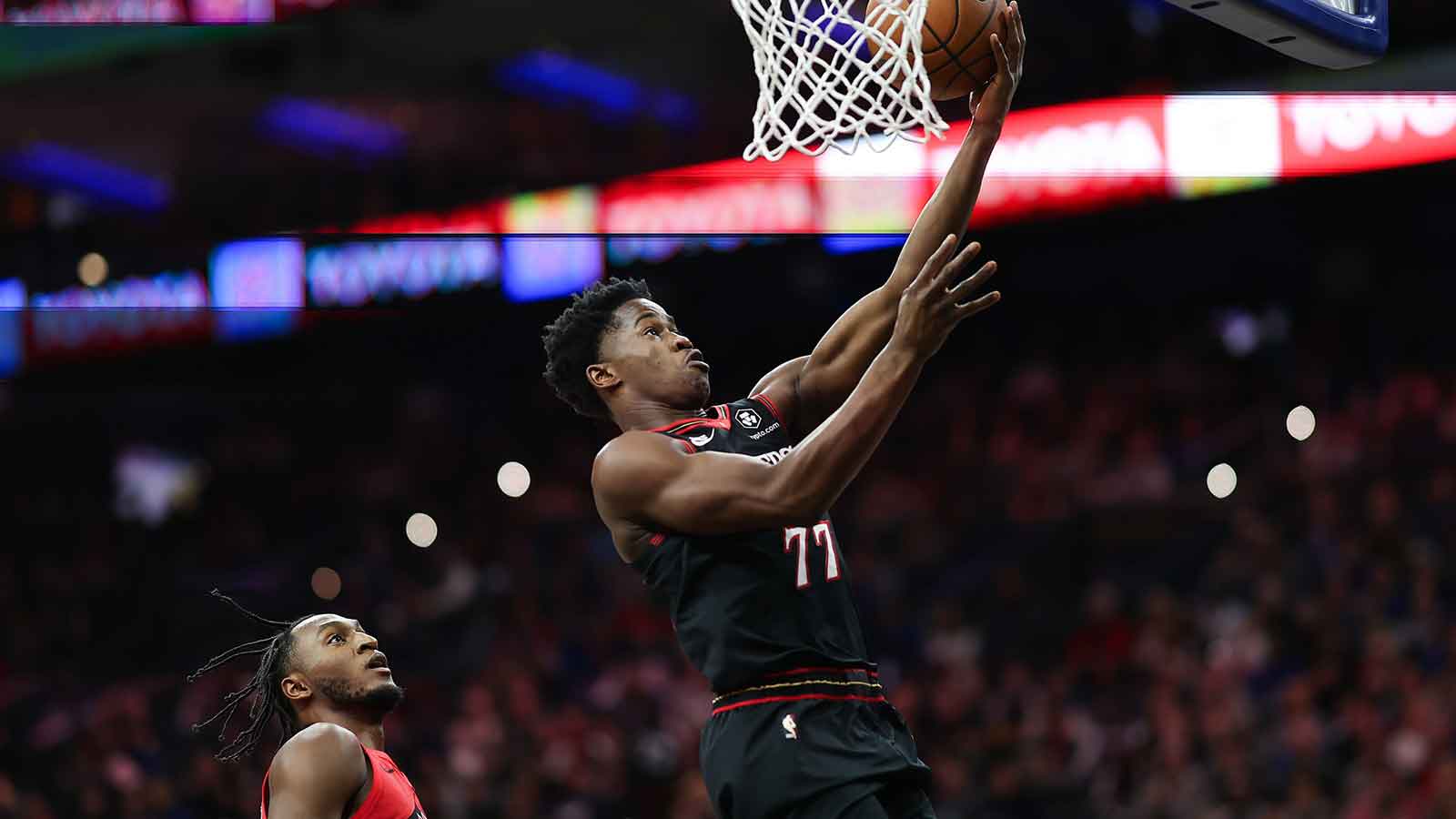 Philadelphia 76ers guard VJ Edgecombe (77) drives for a shot against the Toronto Raptors during the first quarter at Xfinity Mobile Arena.