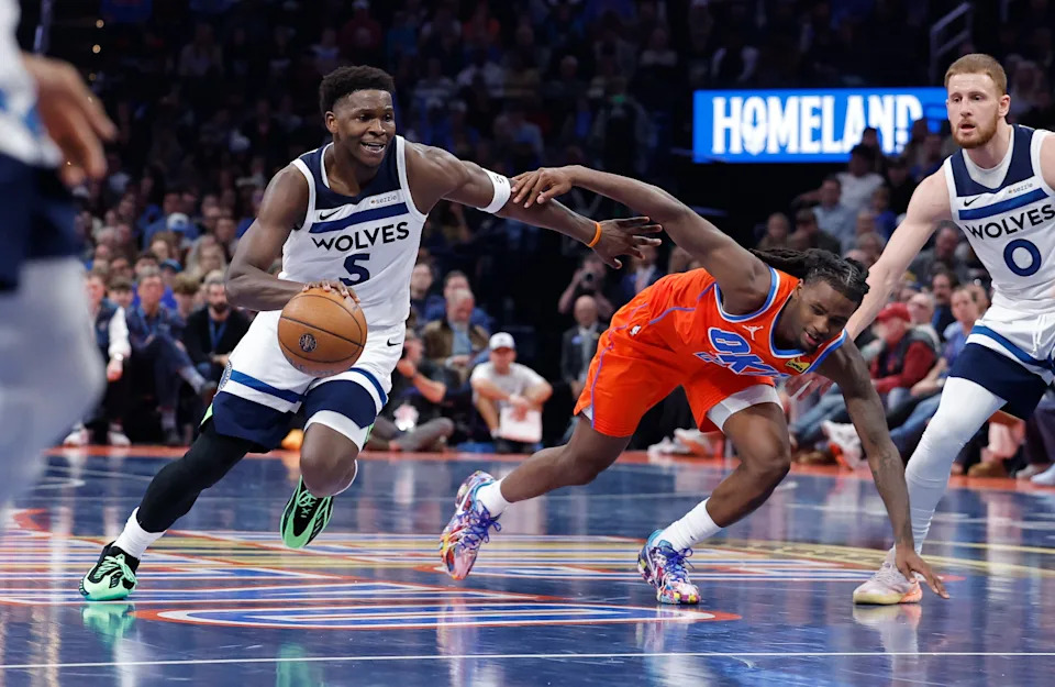 Nov 26, 2025; Oklahoma City, Oklahoma, USA; Minnesota Timberwolves guard Anthony Edwards (5) drives to the basket beside Oklahoma City Thunder guard Cason Wallace (22) during the second half at Paycom Center. Mandatory Credit: Alonzo Adams-Imagn Images