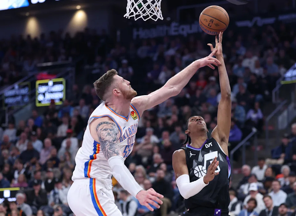 Nov 21, 2025; Salt Lake City, Utah, USA;Utah Jazz forward Cody Williams (5) goes to the basket against Oklahoma City Thunder center Isaiah Hartenstein (55) during the second half at Delta Center. Mandatory Credit: Rob Gray-Imagn Images