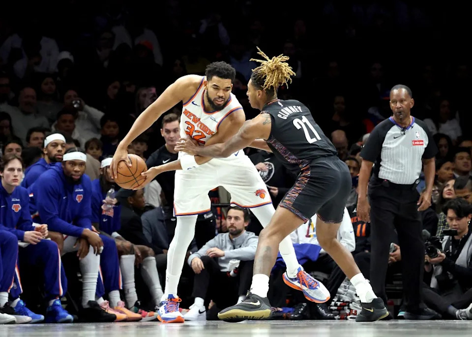 Karl-Anthony Towns of the New York Knicks looks for an opening as Noah Clowney #21 of the Brooklyn Nets defends during the first quarter. Charles Wenzelberg for The New York Post