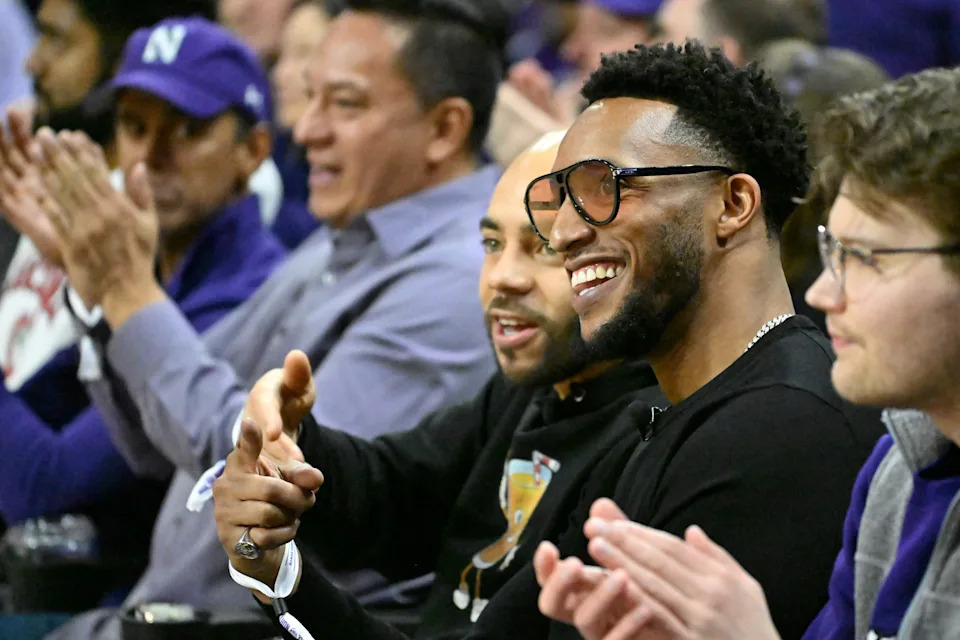 Jan 27, 2024; Evanston, Illinois, USA; Evan Turner, 2nd from right, a former player for the Ohio State Buckeyes and former NBA player is seen talking with Michael ÒJuiceÓ Thompson, a former Northwestern Wildcats player before the first half of the teams game at Welsh-Ryan Arena. Mandatory Credit: Matt Marton-USA TODAY Sports