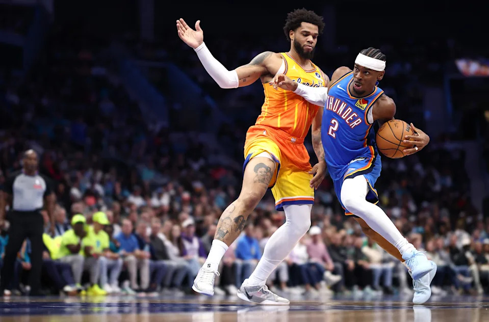 CHARLOTTE, NORTH CAROLINA - NOVEMBER 15: Shai Gilgeous-Alexander #2 of the Oklahoma City Thunder drives to the basket against Miles Bridges #0 of the Charlotte Hornets during the second quarter of the game at Spectrum Center on November 15, 2025 in Charlotte, North Carolina. NOTE TO USER: User expressly acknowledges and agrees that, by downloading and or using this photograph, User is consenting to the terms and conditions of the Getty Images License Agreement. (Photo by Jared C. Tilton/Getty Images)
