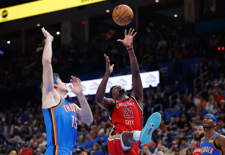 Nov 2, 2025; Oklahoma City, Oklahoma, USA; New Orleans Pelicans center Yves Missi (21) shoots beside Oklahoma City Thunder center Branden Carlson (15) during the second half at Paycom Center. Mandatory Credit: Alonzo Adams-Imagn Images