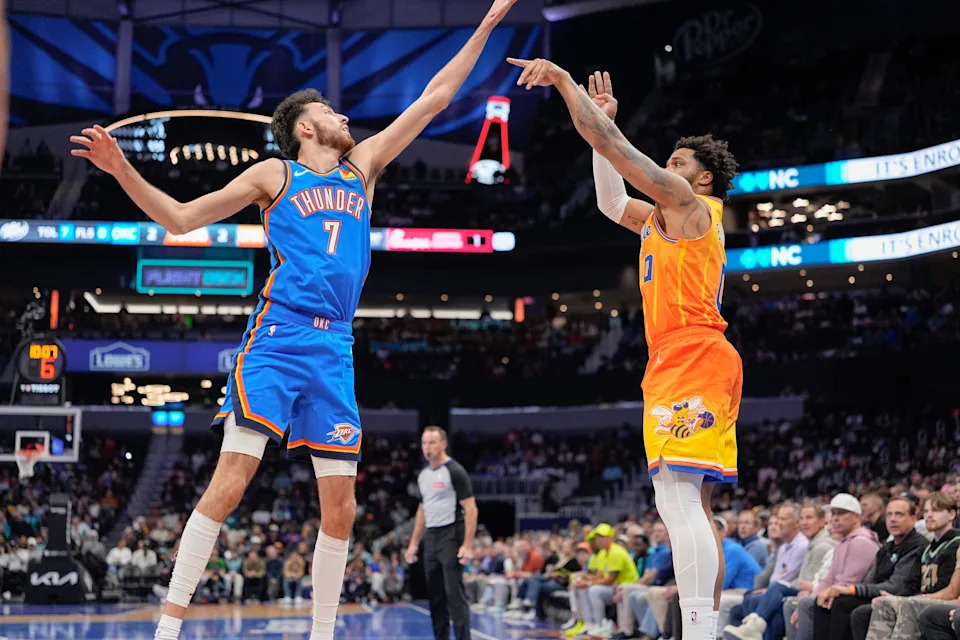 Nov 15, 2025; Charlotte, North Carolina, USA; Charlotte Hornets forward Miles Bridges (0) shoots over Oklahoma City Thunder center Chet Holmgren (7) during the first half at Spectrum Center. Mandatory Credit: Jim Dedmon-Imagn Images