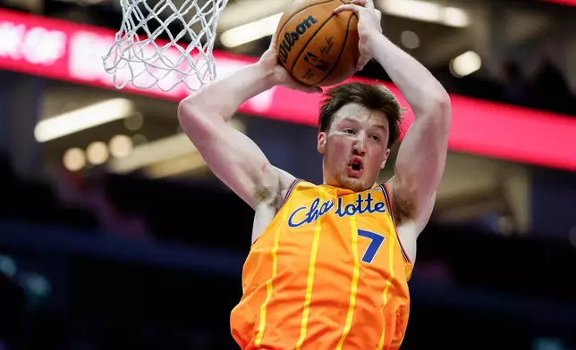 Charlotte Hornets guard Kon Knueppel rebounds against the Oklahoma City Thunder during the second half of an NBA basketball game in Charlotte, N.C., Saturday, Nov. 15, 2025. (AP Photo/Nell Redmond)
