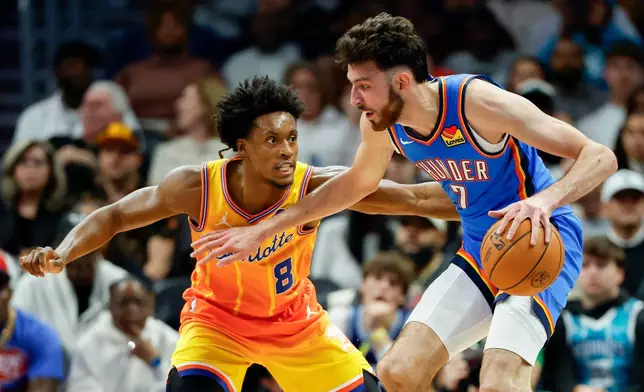 Oklahoma City Thunder center Chet Holmgren (7) drives against Charlotte Hornets guard Collin Sexton during the first half of an NBA basketball game in Charlotte, N.C., Saturday, Nov. 15, 2025. (AP Photo/Nell Redmond)