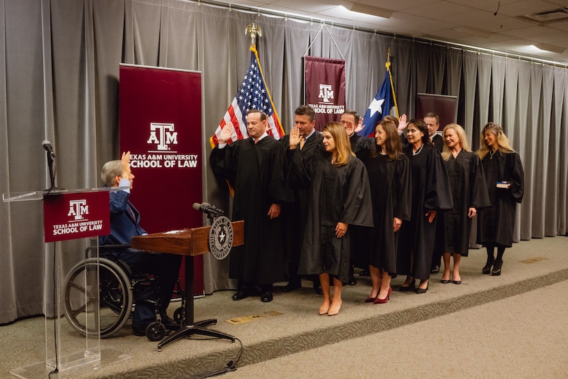 Gov. Greg Abbott swears in newly appointed judges to the Texas Business Court at an official...