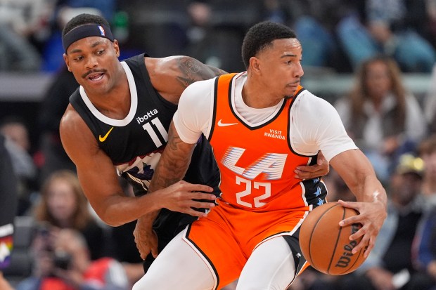 Clippers guard Jordan Miller handles the ball while pressured by...