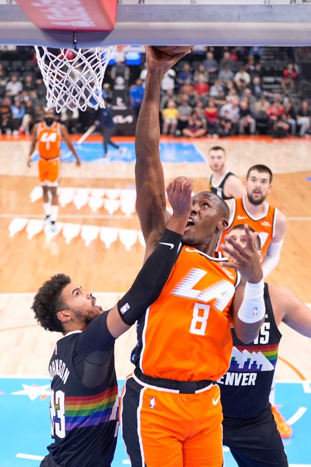 Clippers guard Kris Dunn (8) shoots as Denver Nuggets forward...