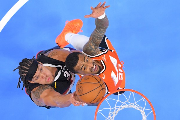 Denver Nuggets forward Aaron Gordon, left, and Clippers forward John...