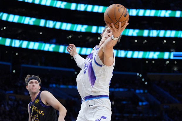 Utah Jazz forward Lauri Markkanen grabs a rebound as Lakers...