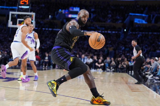 Lakers star LeBron James goes after a loose ball during...