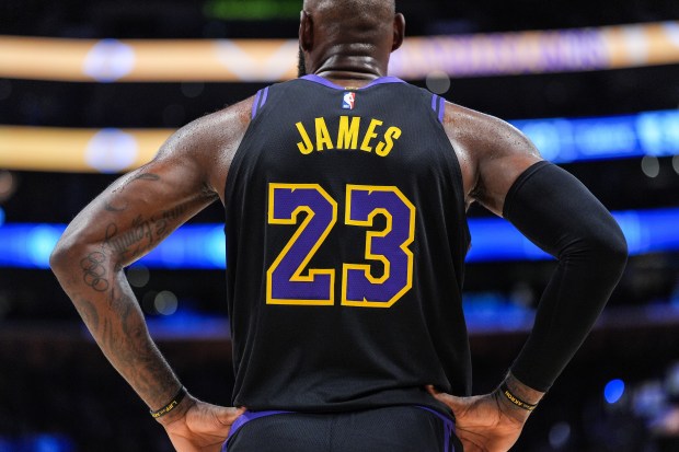 Lakers star LeBron James stands on the court during the...