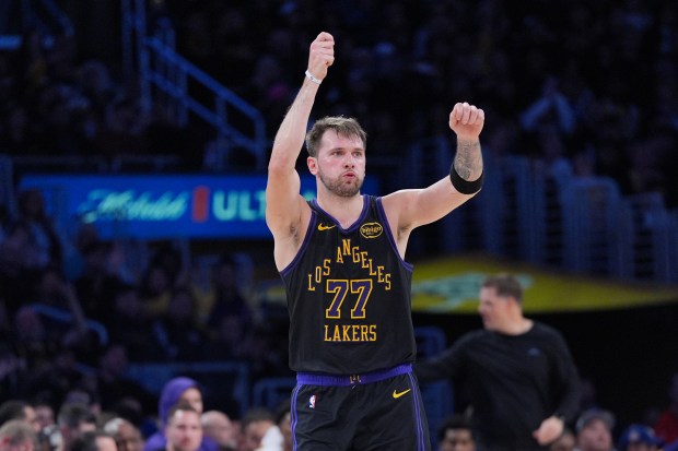 Lakers star Luka Doncic celebrates after making a 3-point shot...