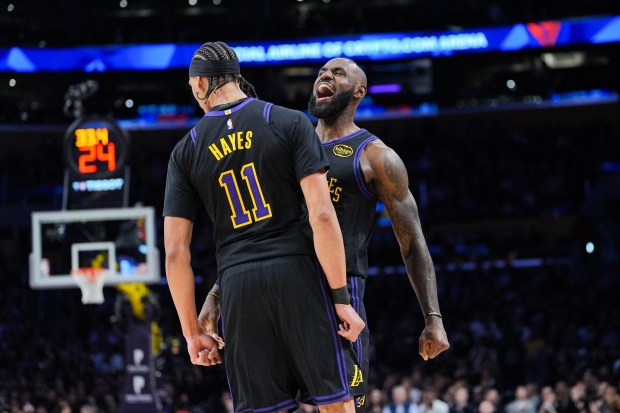 Lakers center Jaxson Hayes, left, and forward LeBron James celebrate...