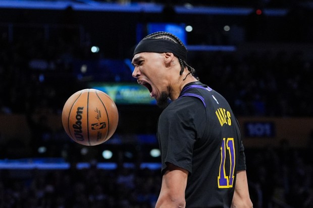 Lakers center Jaxson Hayes celebrates after his dunk during the...