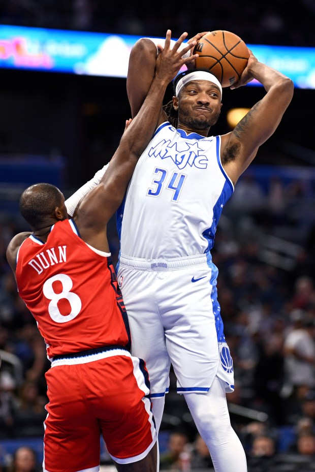 Orlando Magic center Wendell Carter Jr. grabs a rebound in...