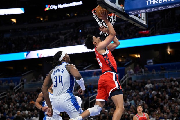 Clippers guard Kobe Sanders puts up a shot in front...