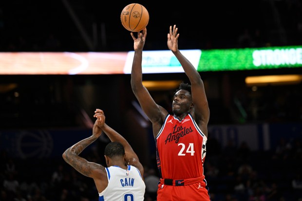 Clippers guard Kobe Brown shoots over Orlando Magic forward Jamal...