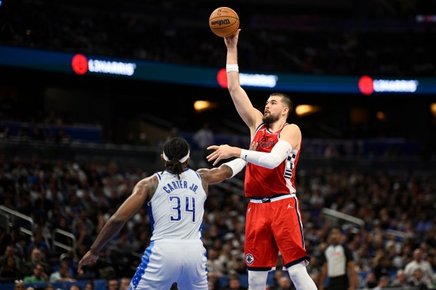 Clippers center Ivica Zubac shoots over Orlando Magic center Wendell...