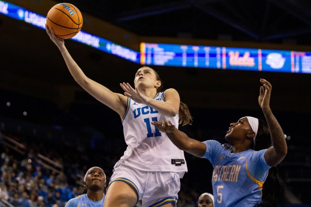 UCLA forward Gabriela Jaquez (11) lays up the ball during...