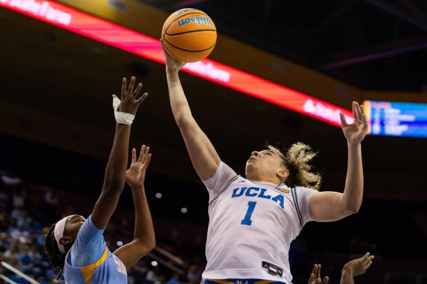 UCLA guard Kiki Rice (1) rebounds the ball during the...