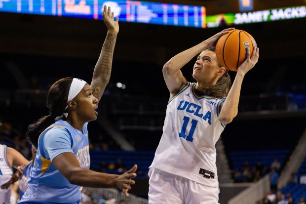 UCLA forward Gabriela Jaquez (11) is defended by Southern during...