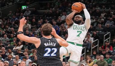 Boston Celtics guard Jaylen Brown (7) takes a shot over Orlando Magic forward Franz Wagner (22) during the first half of an NBA basketball game, Sunday, Nov. 23, 2025, in Boston. (AP Photo/Charles Krupa)