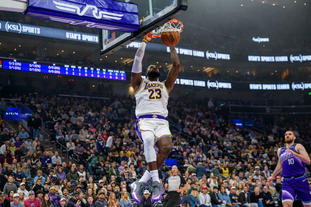 Lakers forward LeBron James dunks the ball during the first...