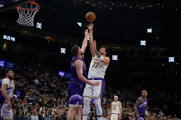 Lakers guard Luka Doncic (77) shoots the ball over Utah...