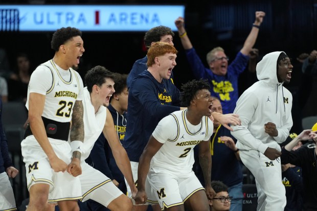 Michigan players celebrate a score against San Diego State during the second half of an NCAA college basketball game in Las Vegas, Monday, Nov. 24, 2025. (AP Photo/Eric Gay)