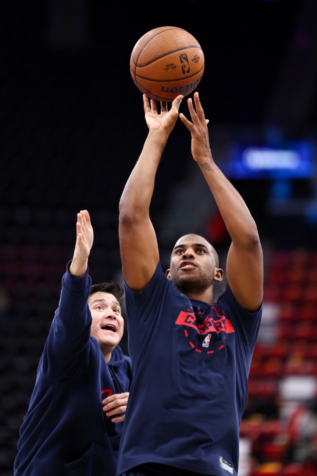 Clippers guard Chris Paul warms up before a game against...