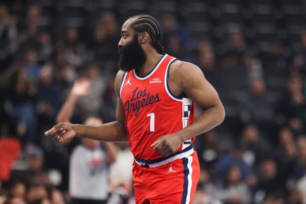 Clippers guard James Harden gestures after making a 3-point shot...