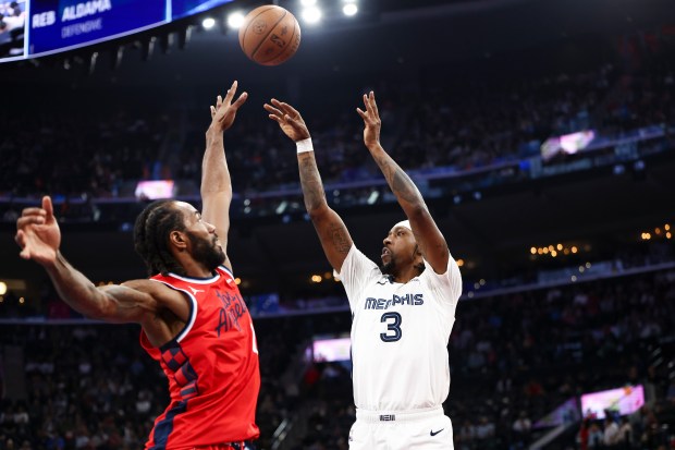 Memphis Grizzlies guard Kentavious Caldwell-Pope (3) shoots against Clippers forward...